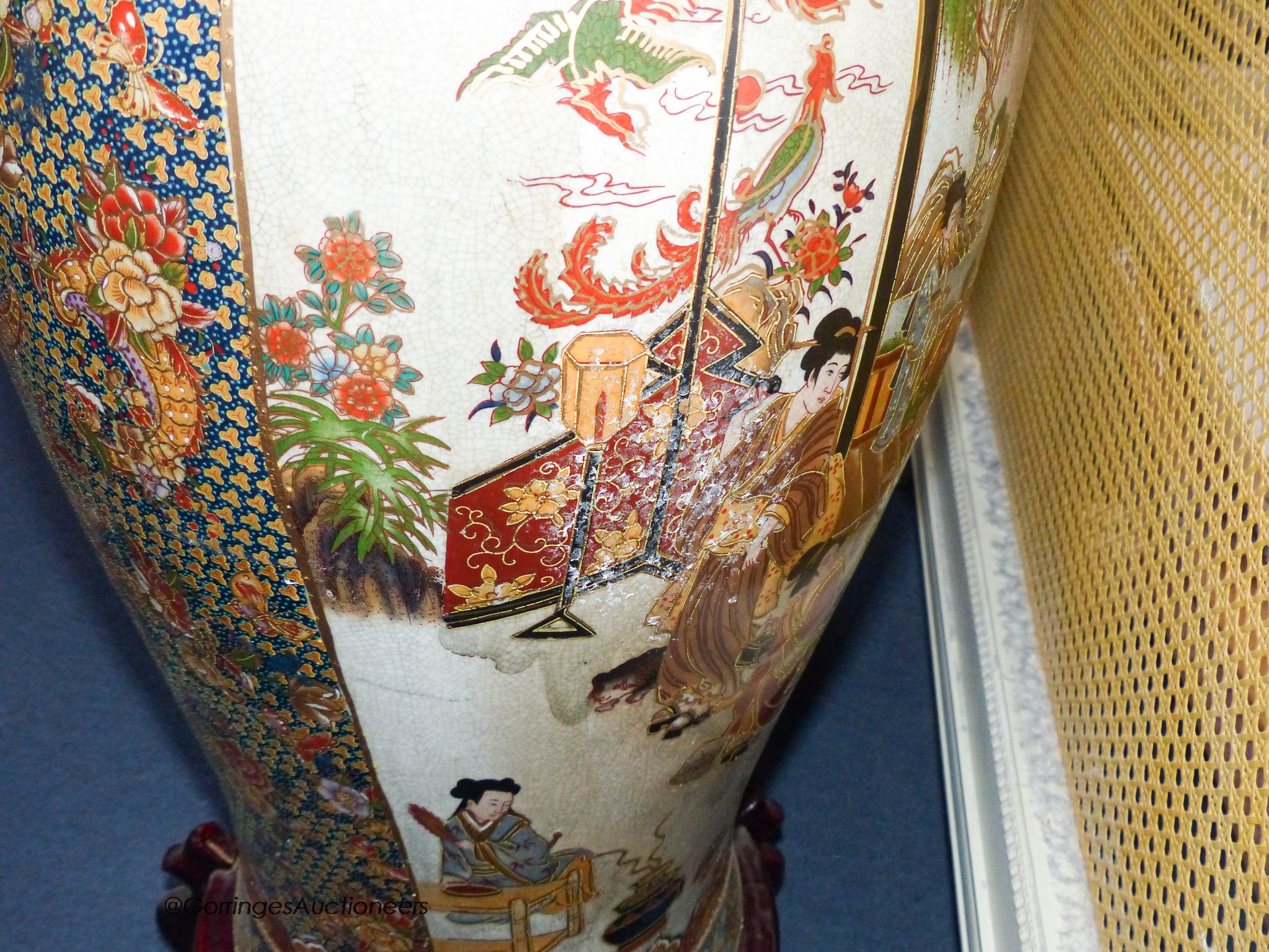 A pair of large Japanese vases, on hardwood stands